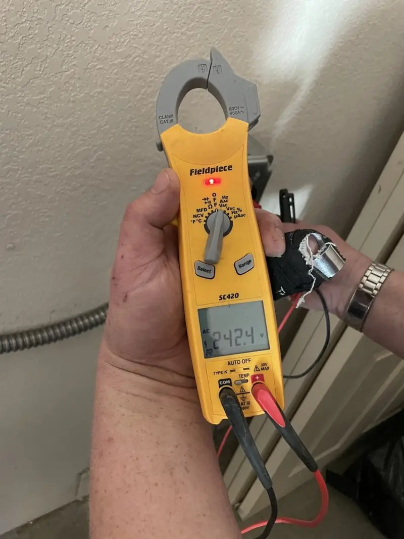 Voltage testing with clamp meter during Whole House Surge Protector in Dublin